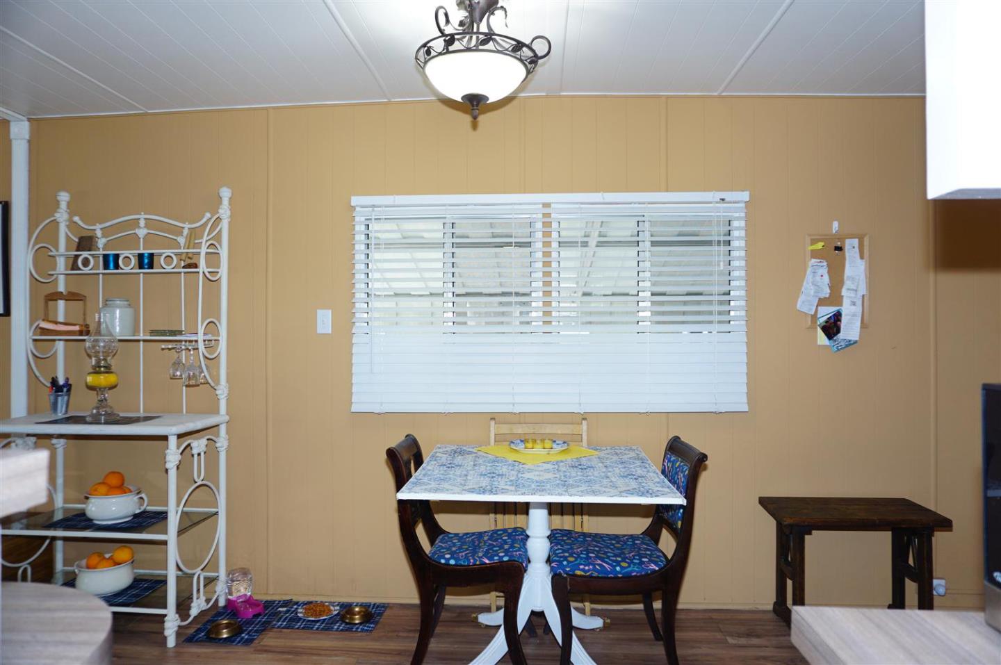 2150 Almaden Road, Unit 62 San Jose, CA 95125 - Photo 12 of 38 a view of a dining room with furniture and a chandelier