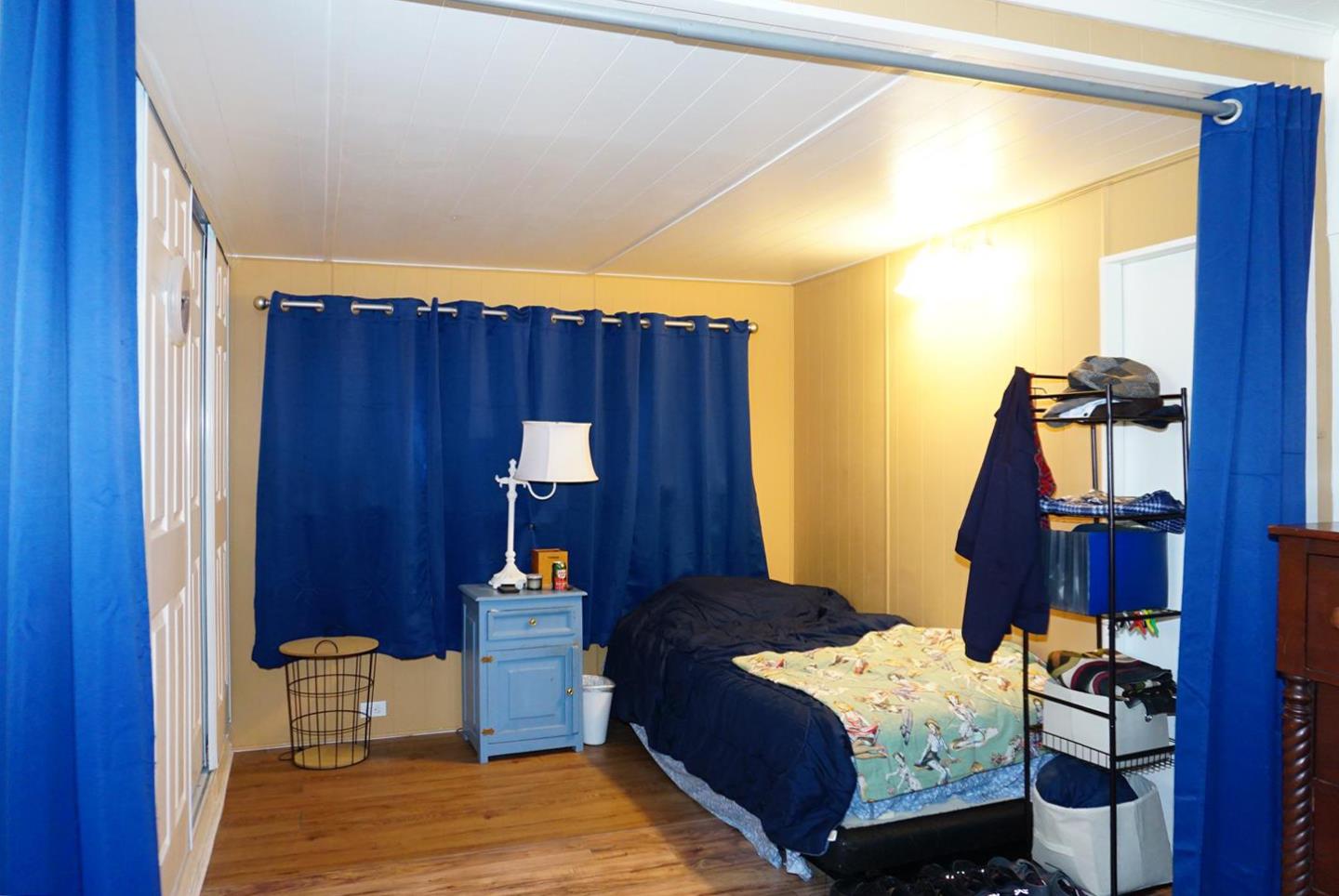 2150 Almaden Road, Unit 62 San Jose, CA 95125 - Photo 19 of 38 a bedroom with a bed and wooden floor