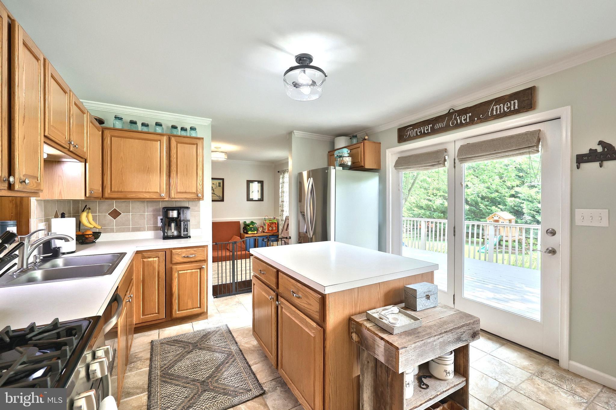 920 Hostetter Road Hanover, PA 17331 - Photo 24 of 49 a very nice looking kitchen with a stove a refrigerator a sink dishwasher with a dining table and chairs