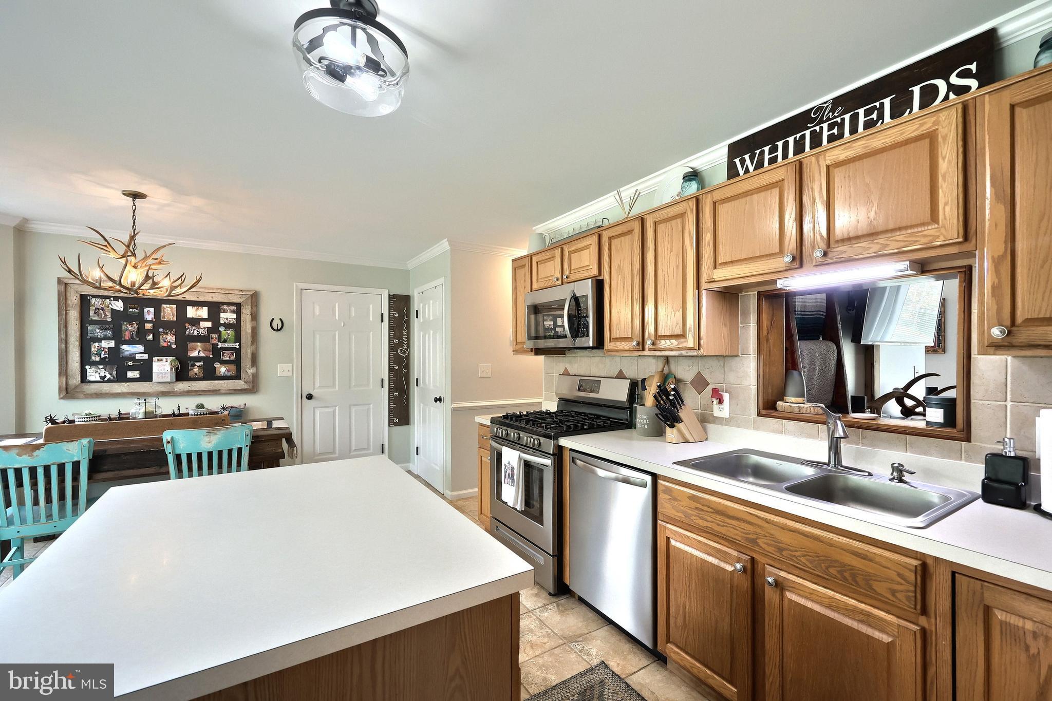 920 Hostetter Road Hanover, PA 17331 - Photo 25 of 49 a kitchen with stainless steel appliances a sink stove and cabinets
