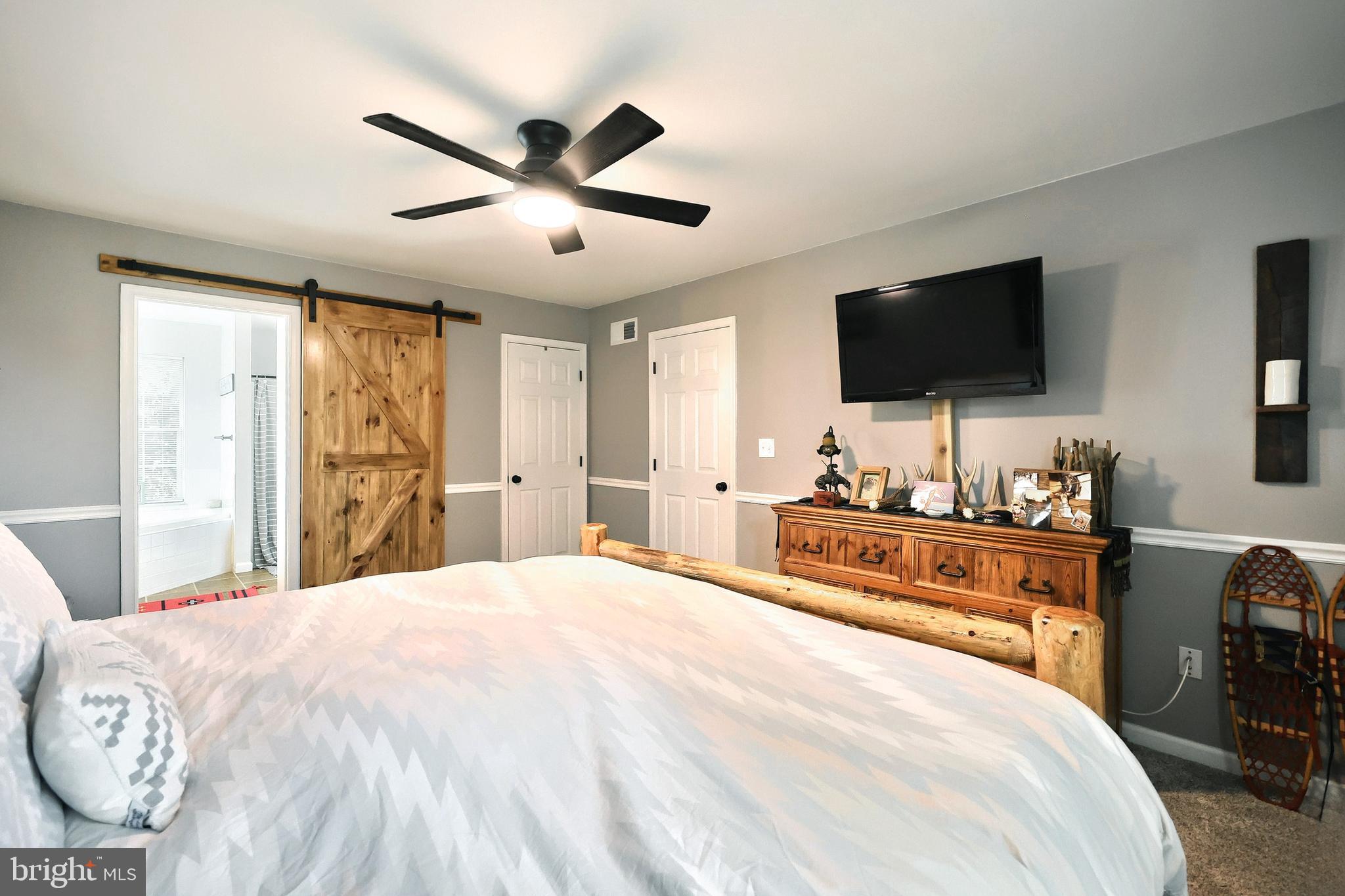 920 Hostetter Road Hanover, PA 17331 - Photo 32 of 49 a bedroom with a bed and a flat screen tv