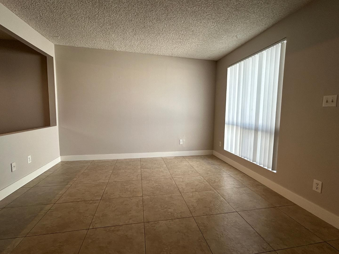 859 South Ext Road Mesa, AZ 85210 - Photo 3 of 19 a view of an empty room with a window