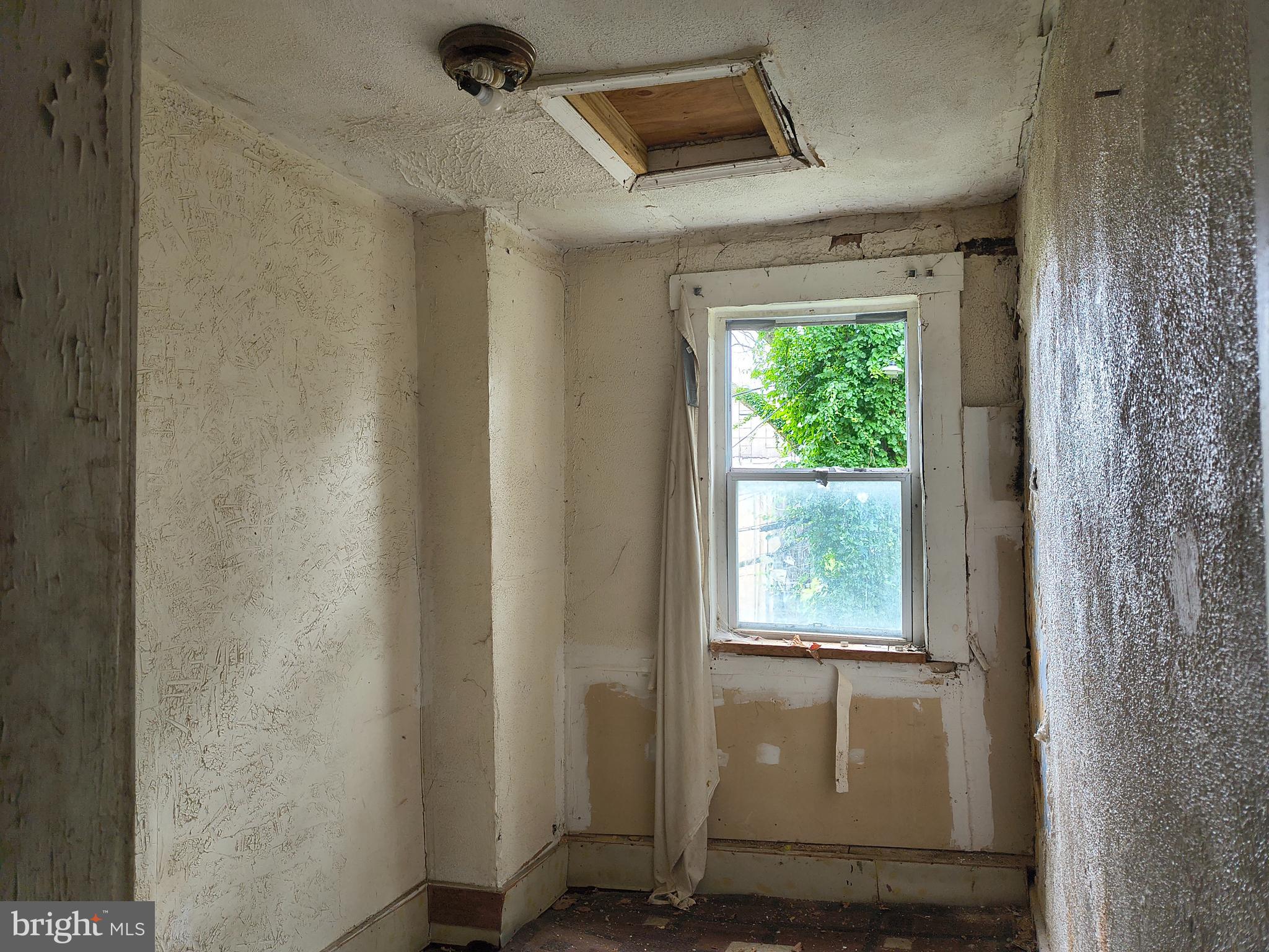 1817 Vine Street Baltimore, MD 21223 - Photo 8 of 9 a front view of a house with a window