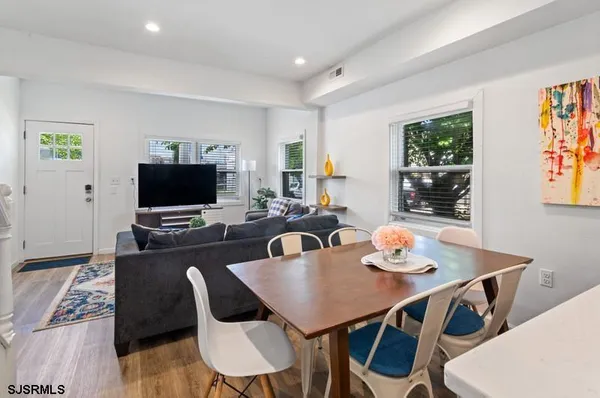 a kitchen with stainless steel appliances granite countertop a refrigerator stove a sink dishwasher and microwave with cabinets