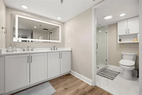 a bathroom with a toilet and a shower
