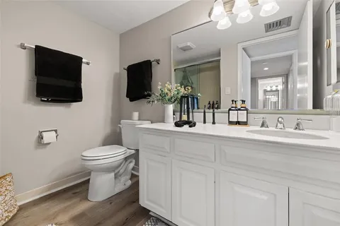 a bathroom with a shower and a sink
