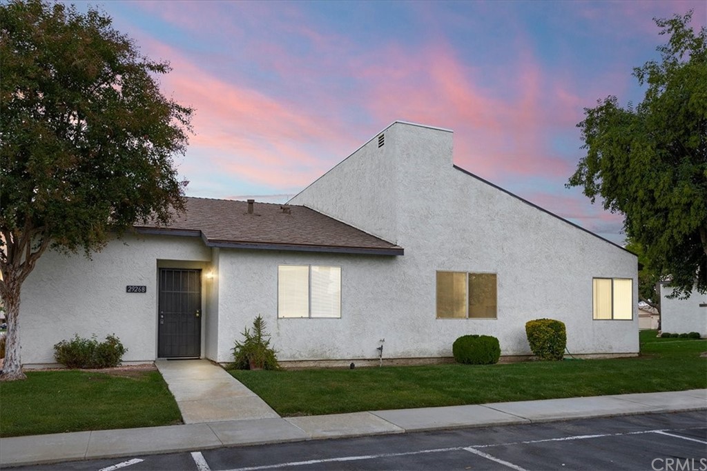 29268 Murrieta Road Menifee, CA 92586 - Photo 1 of 1 a front view of a house with a yard and garage