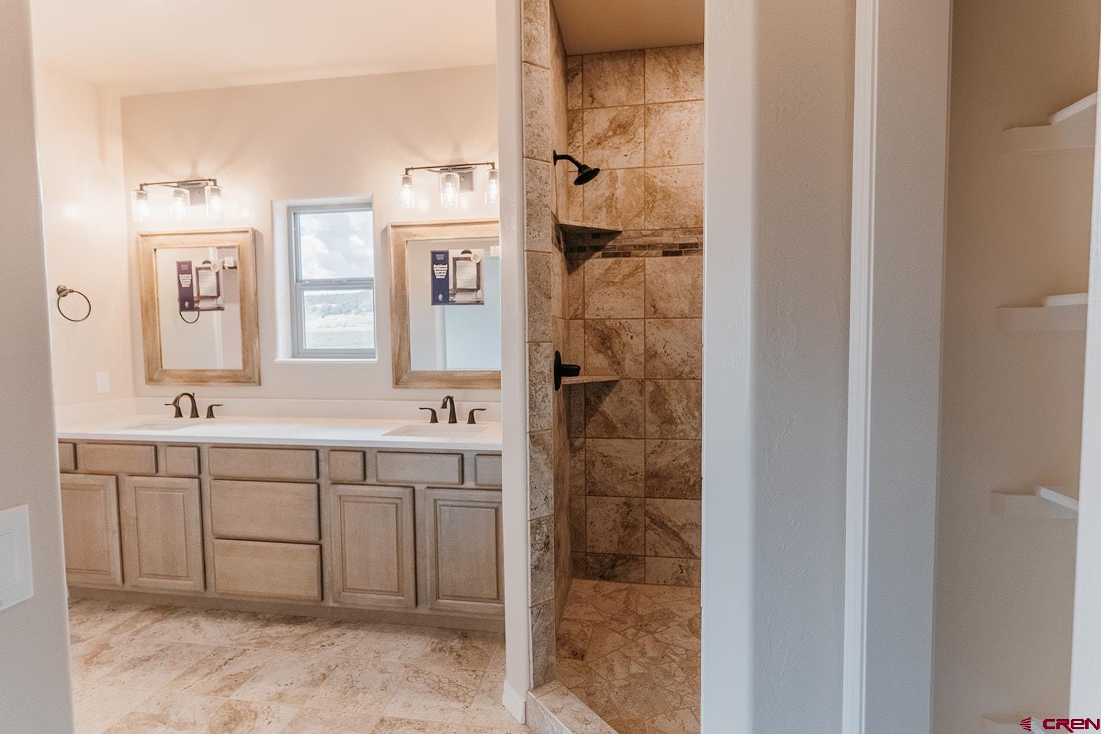 22280 6845 Road Montrose, CO 81403 - Photo 11 of 34 a spacious bathroom with a shower and a sink