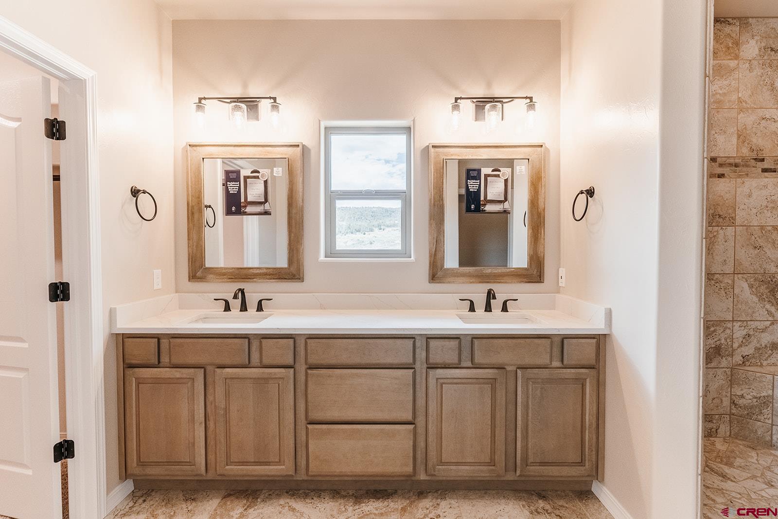22280 6845 Road Montrose, CO 81403 - Photo 12 of 34 a bathroom with a sink and a mirror