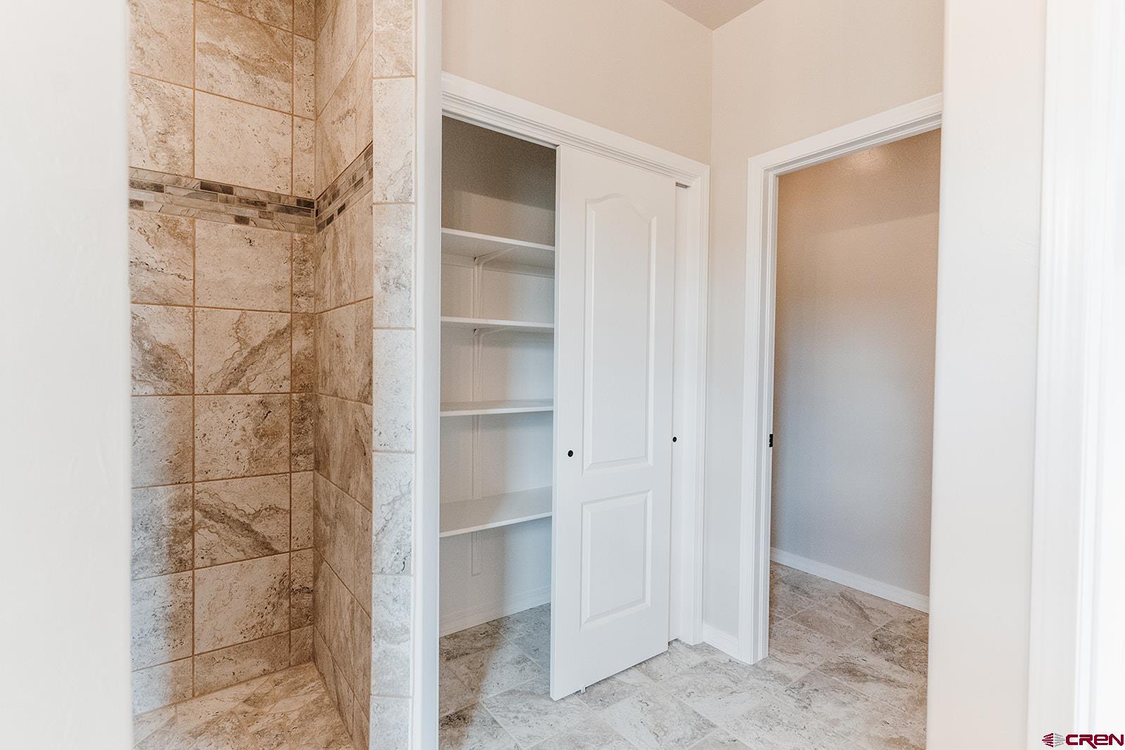 22280 6845 Road Montrose, CO 81403 - Photo 13 of 34 a bathroom with a shower