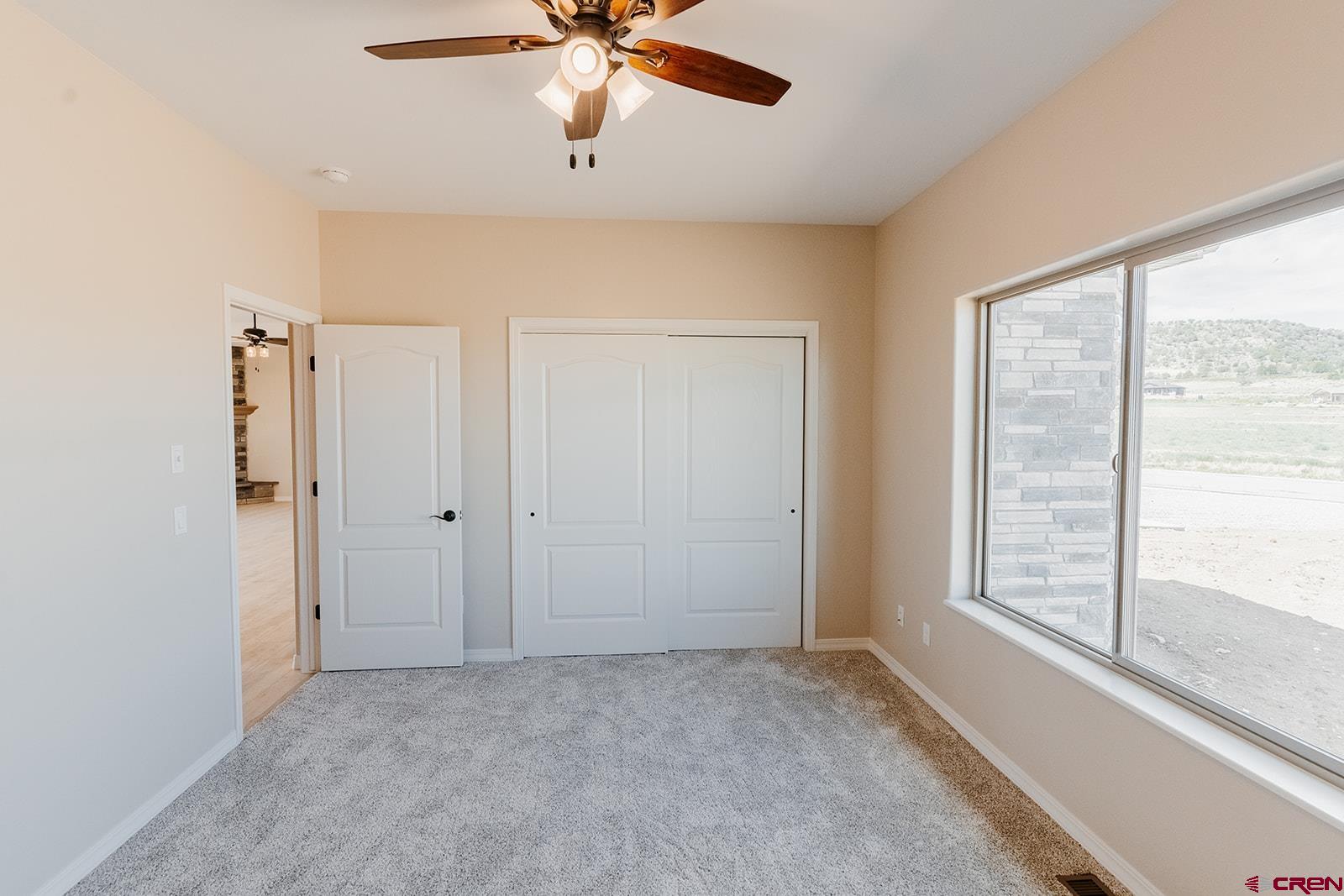 22280 6845 Road Montrose, CO 81403 - Photo 17 of 34 a view of an empty room with a window