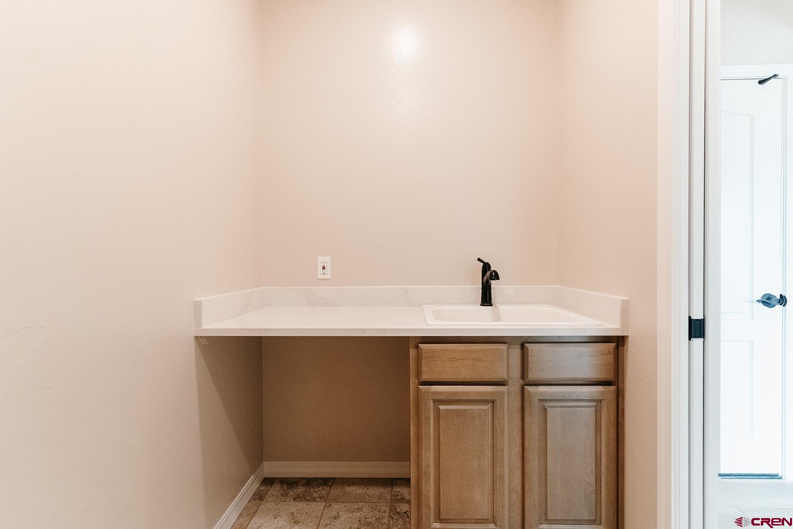 22280 6845 Road Montrose, CO 81403 - Photo 21 of 34 a view of utility room with sink