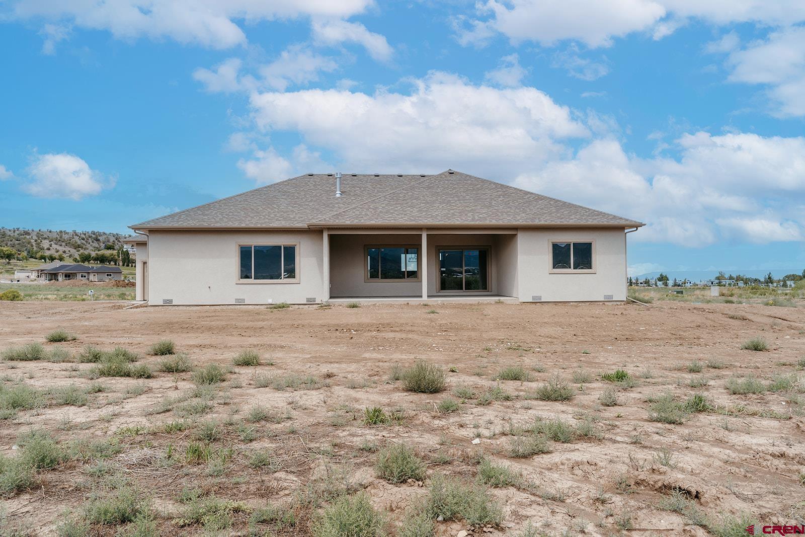 22280 6845 Road Montrose, CO 81403 - Photo 24 of 34 a view of a house with a yard