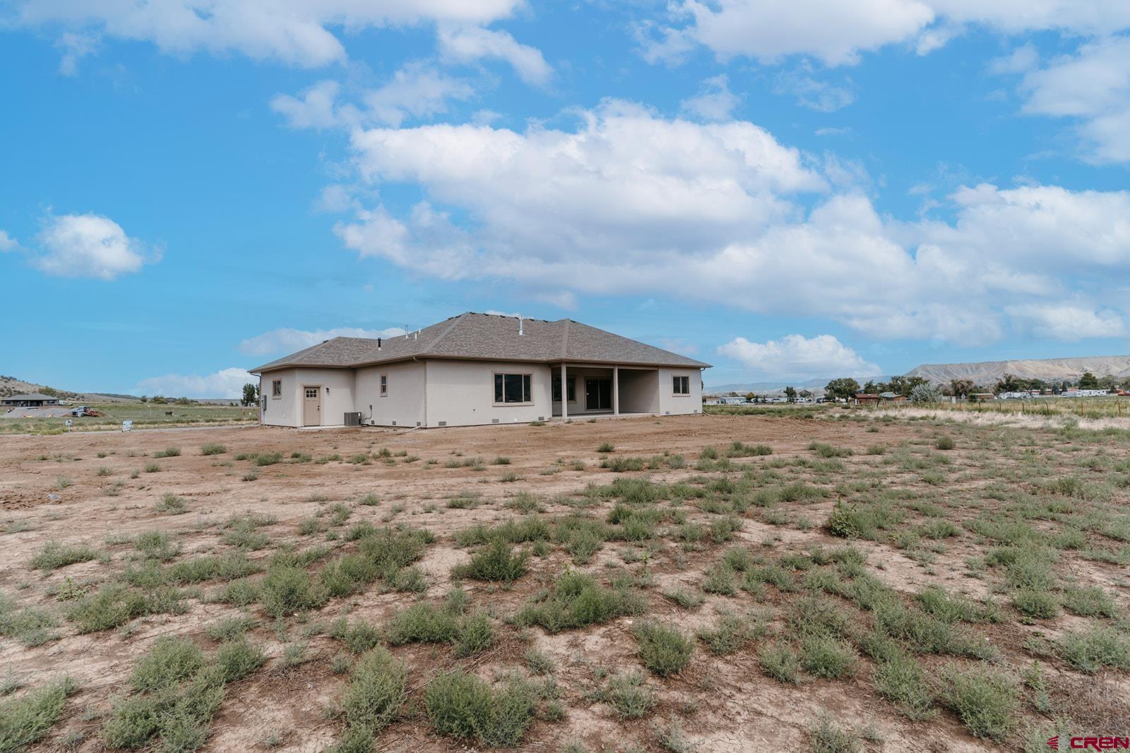 22280 6845 Road Montrose, CO 81403 - Photo 25 of 34 a view of a house with a dry yard