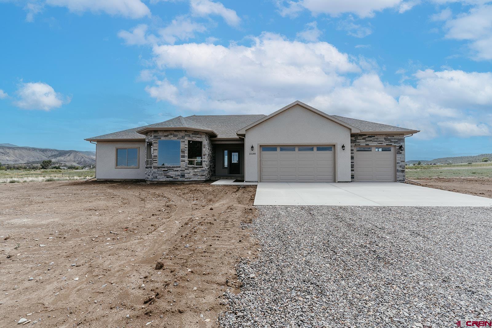 22280 6845 Road Montrose, CO 81403 - Photo 28 of 34 front view of a house with a yard