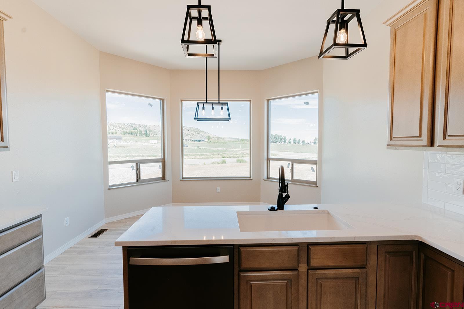 22280 6845 Road Montrose, CO 81403 - Photo 6 of 34 a view of a room with a chandelier furniture and windows