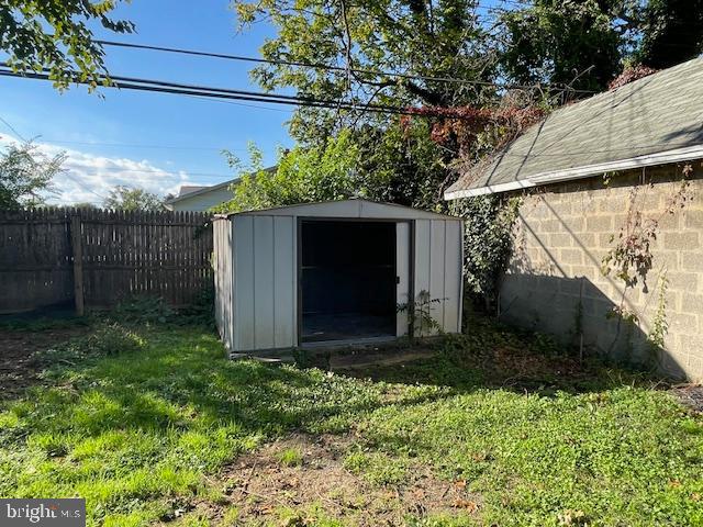 44 Left Wing Drive Middle River, MD 21220 - Photo 11 of 12 a view of backyard with potted plants and a large tree