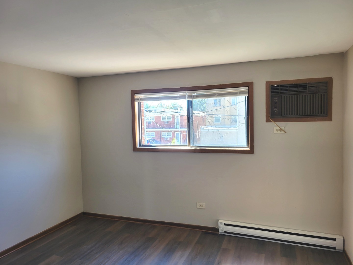 1257 Harding Avenue, Unit A2 Des Plaines, IL 60016 - Photo 8 of 9 an empty room with a window