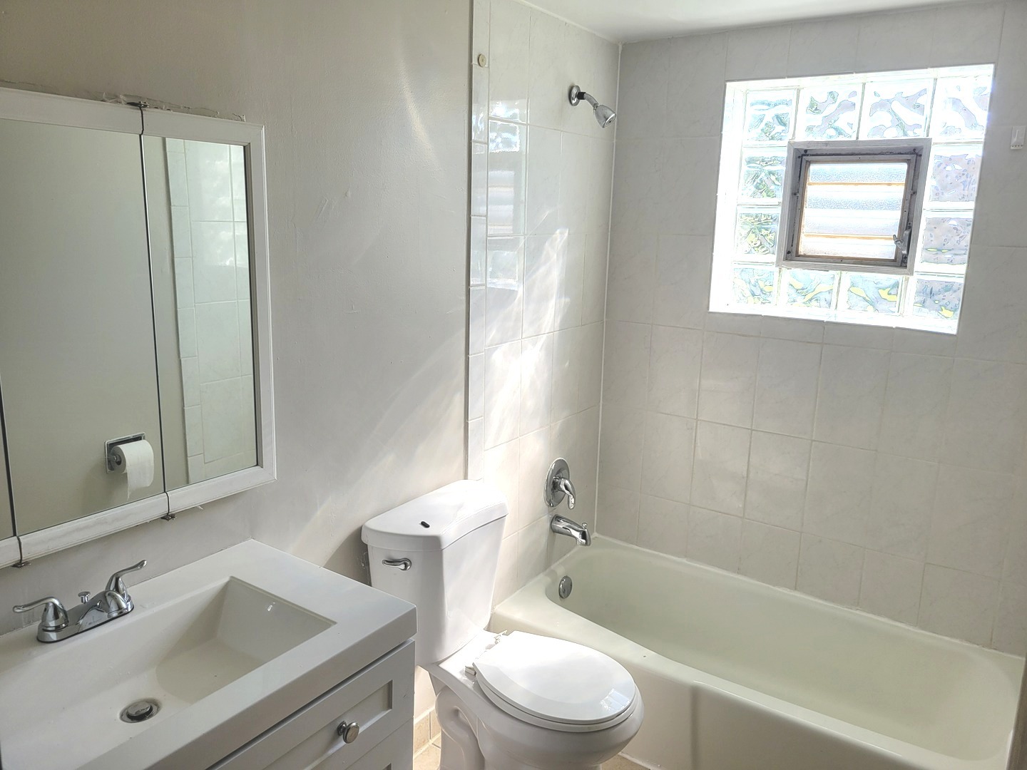 1257 Harding Avenue, Unit A2 Des Plaines, IL 60016 - Photo 9 of 9 a bathroom with a sink toilet and shower