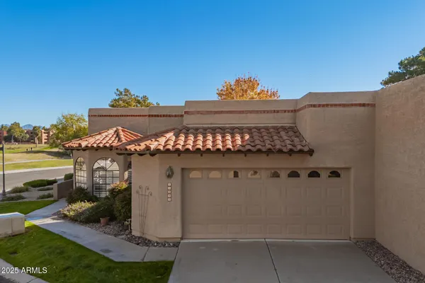 a view of a house with a iron gate