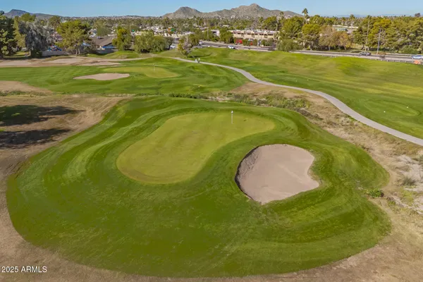 a view of a swimming pool with a lake view