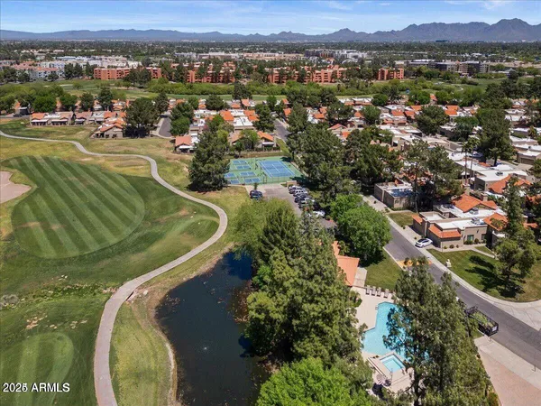 an aerial view of a residential houses and outdoor space