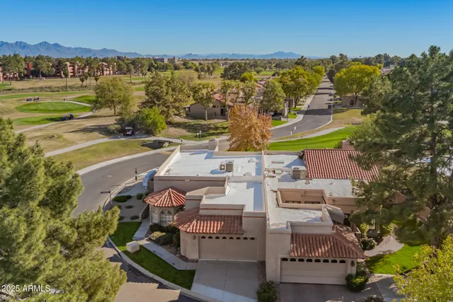 an aerial view of a house with a ocean view