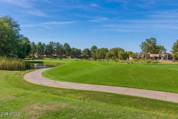 a view of a golf course with a lake