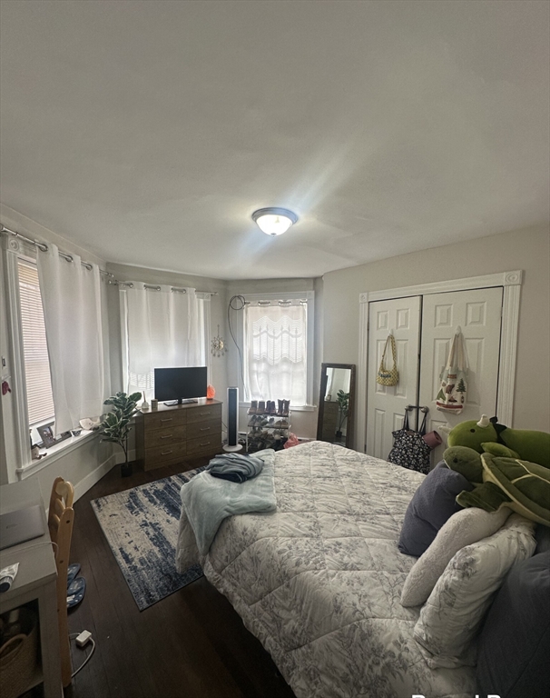 847 Beacon Street, Unit 9 Boston, MA 02215 - Photo 10 of 10 a bedroom with a bed couch and window