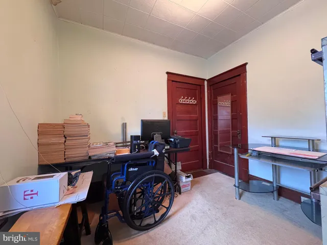 a view of a workspace with furniture