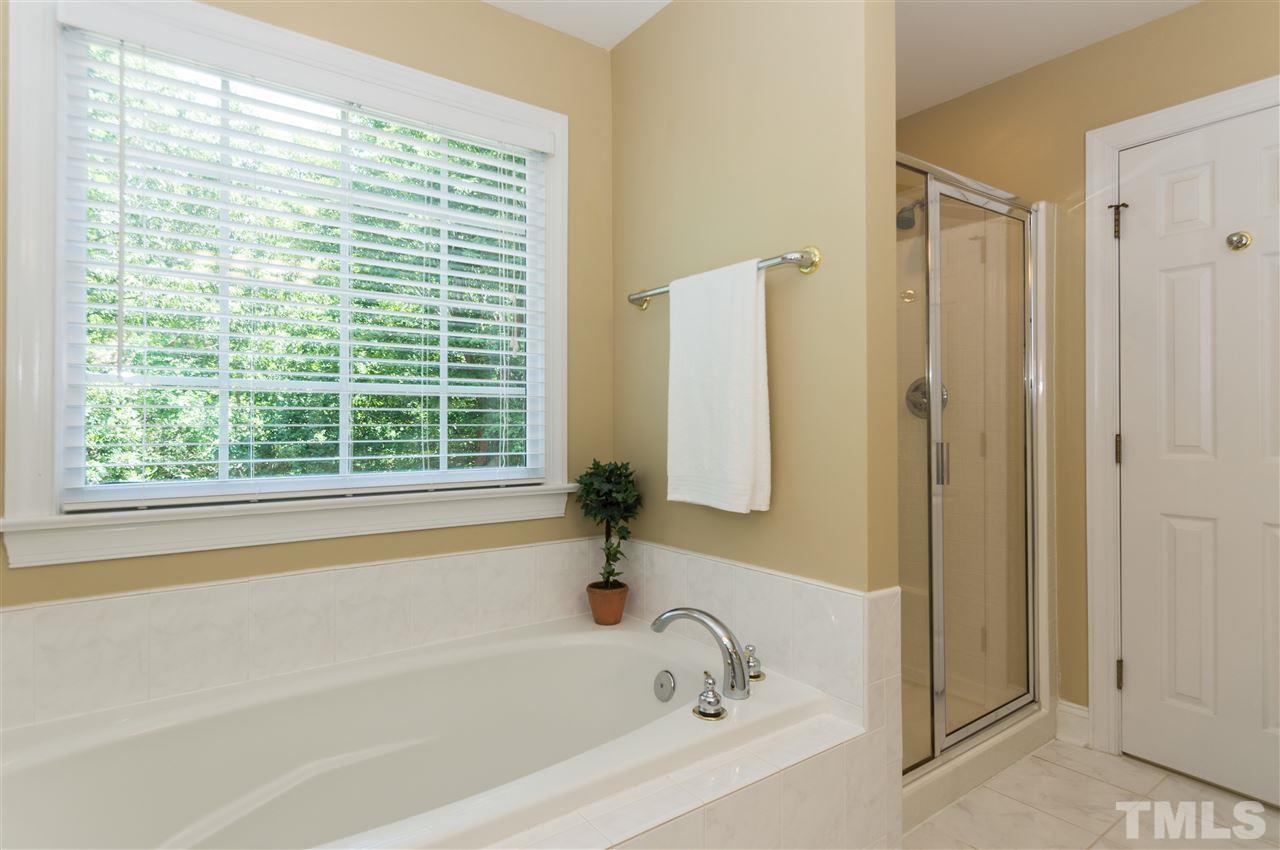 11704 John Allen Road Raleigh, NC 27614 - Photo 14 of 25 a bathroom with a bathtub and a shower
