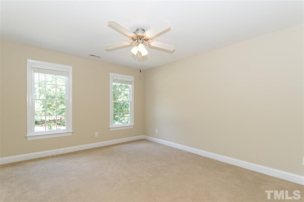 11704 John Allen Road Raleigh, NC 27614 - Photo 16 of 25 an empty room with windows and fan