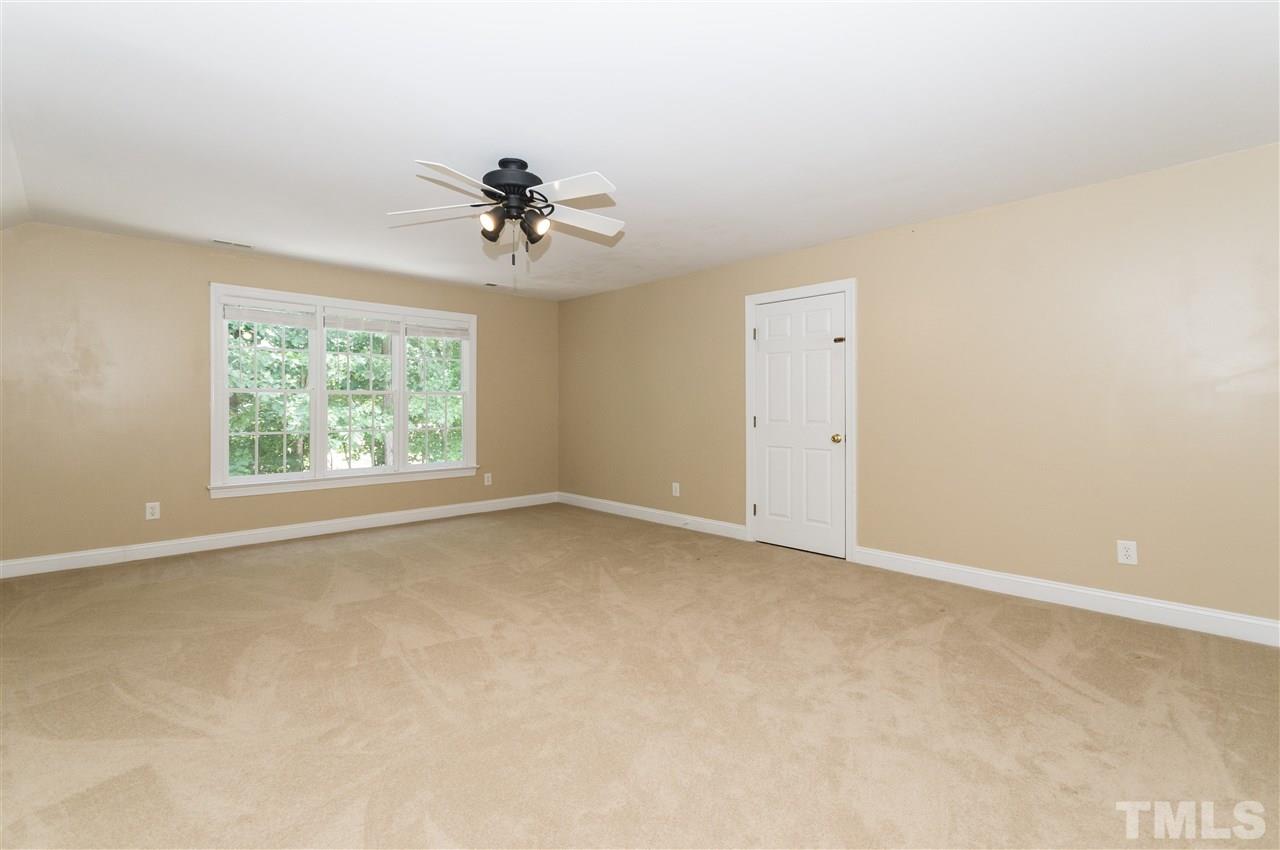 11704 John Allen Road Raleigh, NC 27614 - Photo 18 of 25 an empty room with windows and ceiling fan
