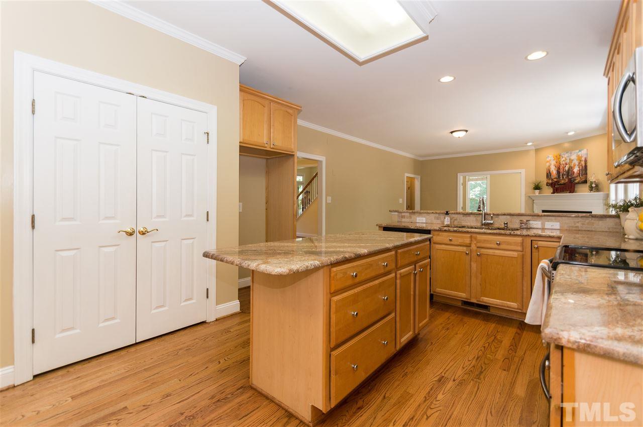 11704 John Allen Road Raleigh, NC 27614 - Photo 9 of 25 a kitchen with stainless steel appliances granite countertop a stove and a sink