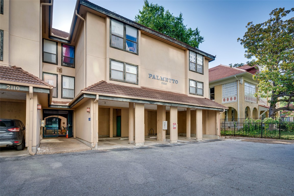 a front view of a house with a road