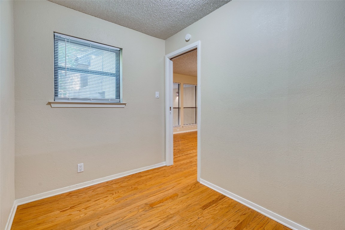 2110 Rio Grande Street, Unit 208 Austin, TX 78705 - Photo 15 of 31 a view of empty room with wooden floor