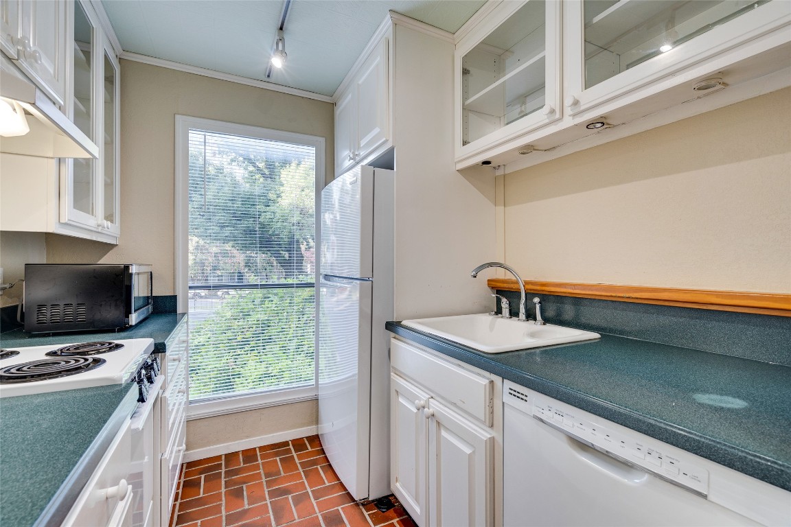 2110 Rio Grande Street, Unit 208 Austin, TX 78705 - Photo 17 of 31 a bathroom with a sink a window and a mirror