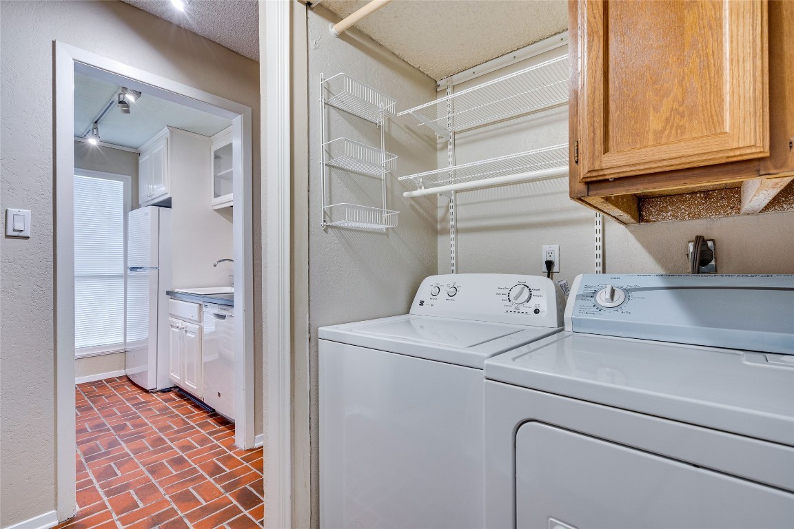 2110 Rio Grande Street, Unit 208 Austin, TX 78705 - Photo 23 of 31 a utility room with dryer and washer