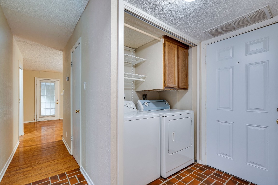 2110 Rio Grande Street, Unit 208 Austin, TX 78705 - Photo 24 of 31 a view of hallway with washer and dryer