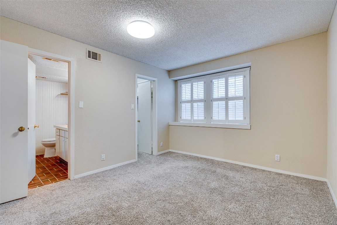2110 Rio Grande Street, Unit 208 Austin, TX 78705 - Photo 26 of 31 an empty room with windows