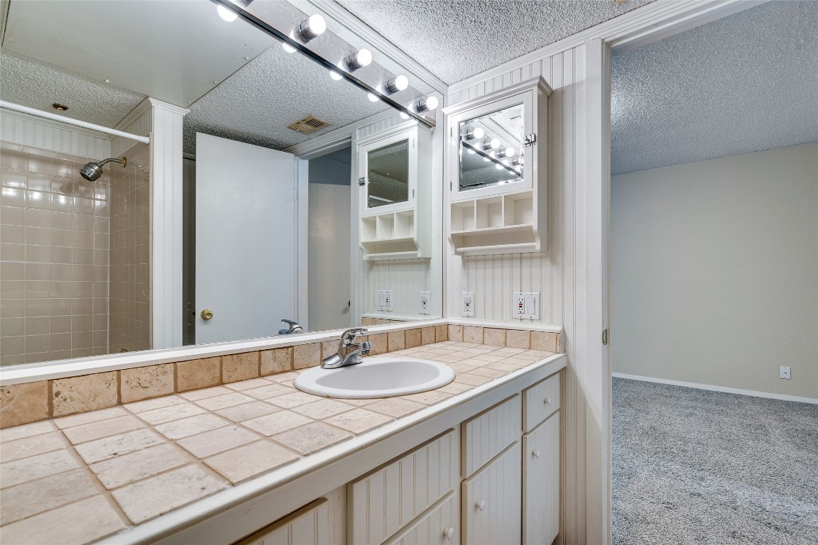 2110 Rio Grande Street, Unit 208 Austin, TX 78705 - Photo 30 of 31 a bathroom with a sink double vanity and a mirror
