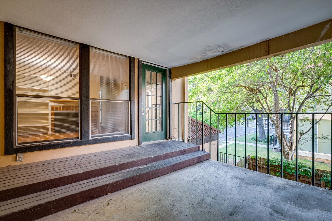 2110 Rio Grande Street, Unit 208 Austin, TX 78705 - Photo 6 of 31 a view of a room with wooden floor and windows