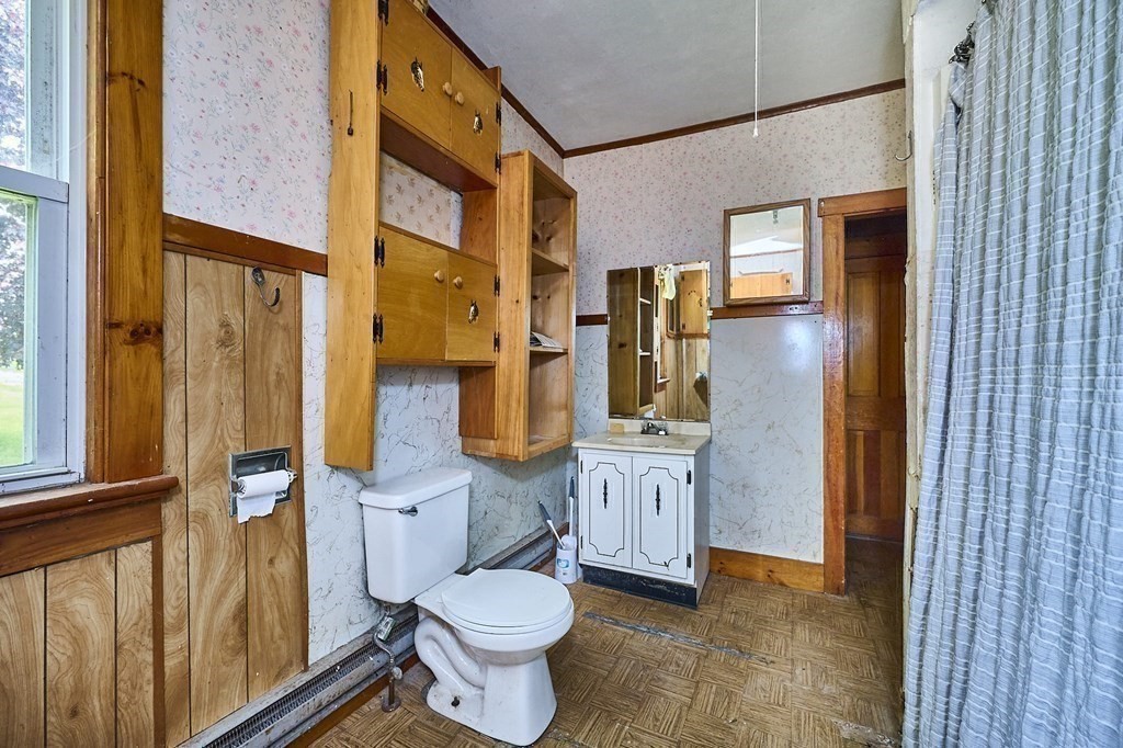 6 Mougin Road Cummington, MA 01026 - Photo 11 of 26 a bathroom with a sink a toilet and a mirror