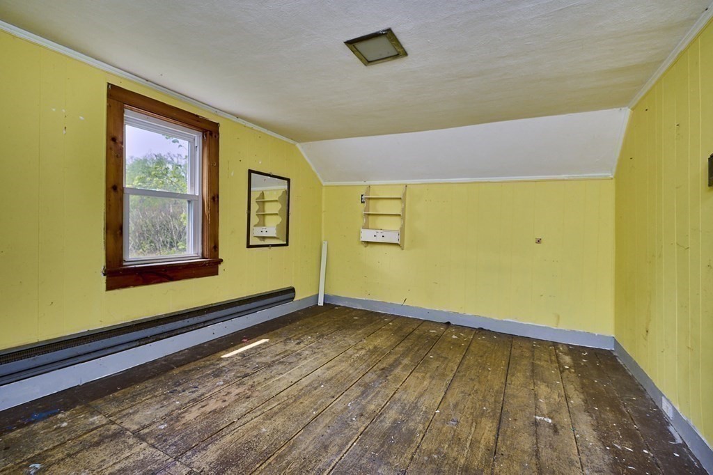 6 Mougin Road Cummington, MA 01026 - Photo 13 of 26 a view of an empty room with wooden floor and a window