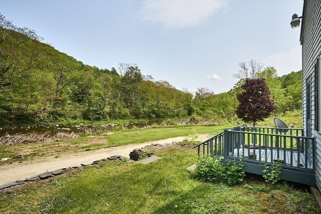 6 Mougin Road Cummington, MA 01026 - Photo 18 of 26 a view of a balcony with an outdoor space and seating area