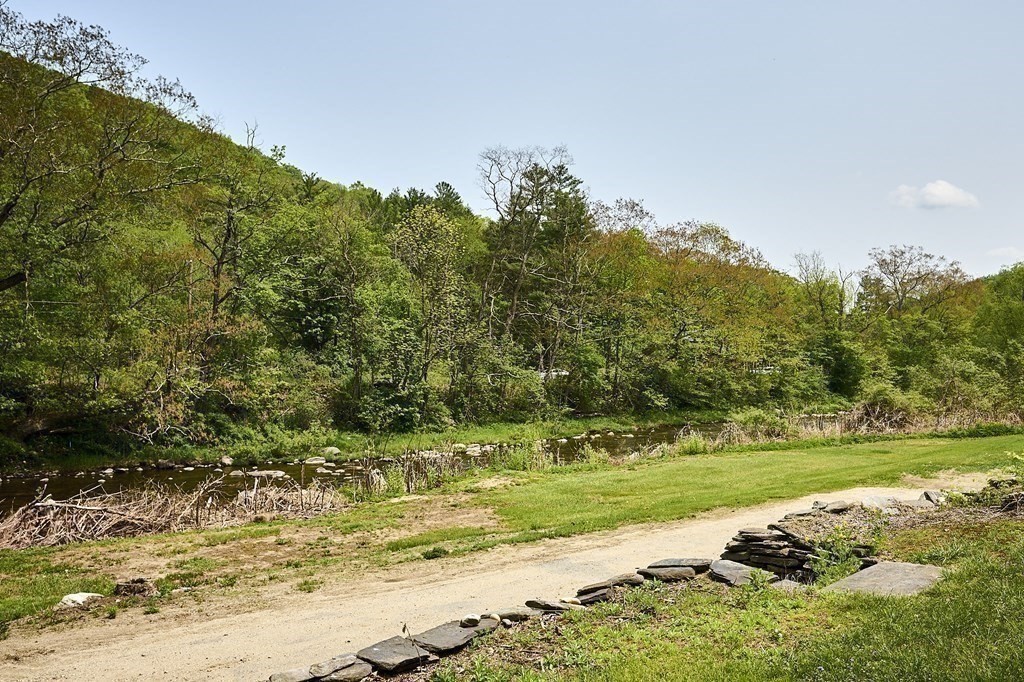 6 Mougin Road Cummington, MA 01026 - Photo 19 of 26 a view of a yard with a house