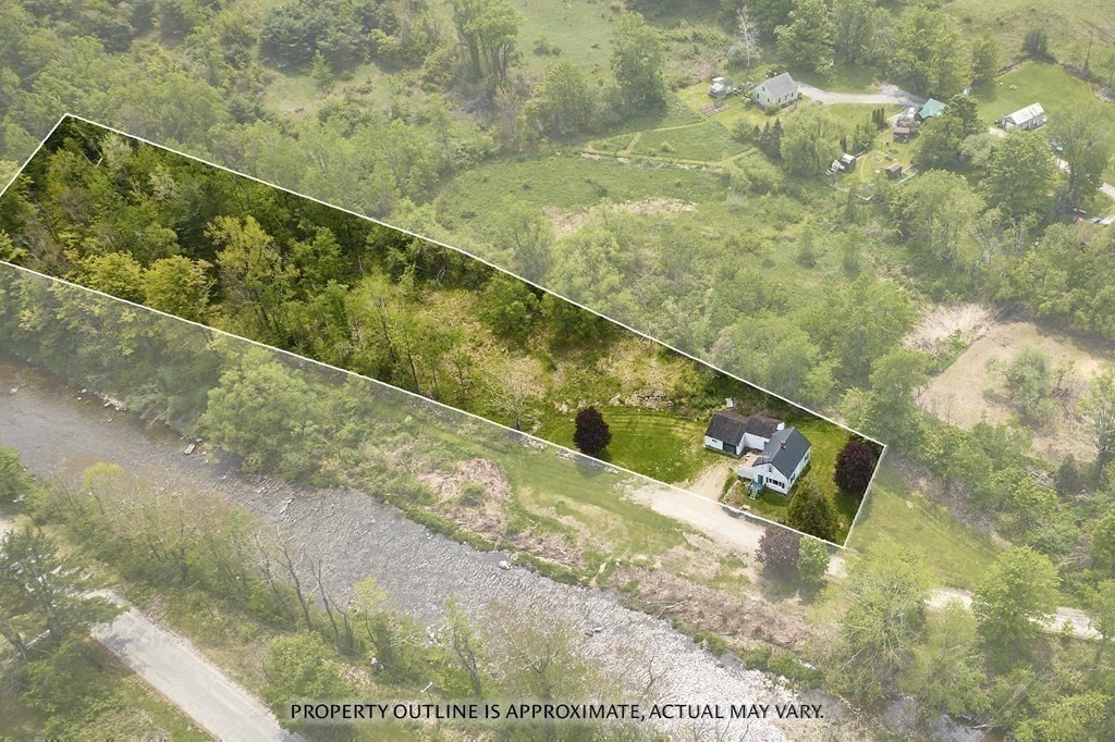 6 Mougin Road Cummington, MA 01026 - Photo 23 of 26 a view of a yard with a wooden fence