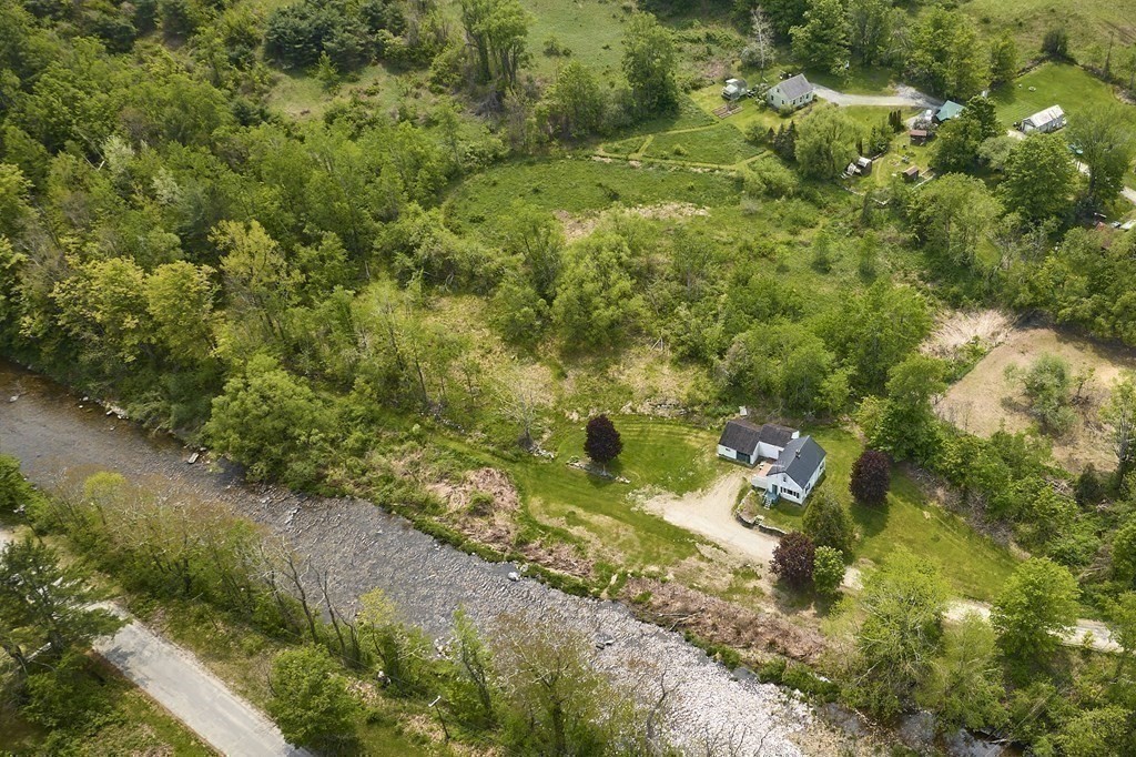 6 Mougin Road Cummington, MA 01026 - Photo 24 of 26 a view of a forest with a houses