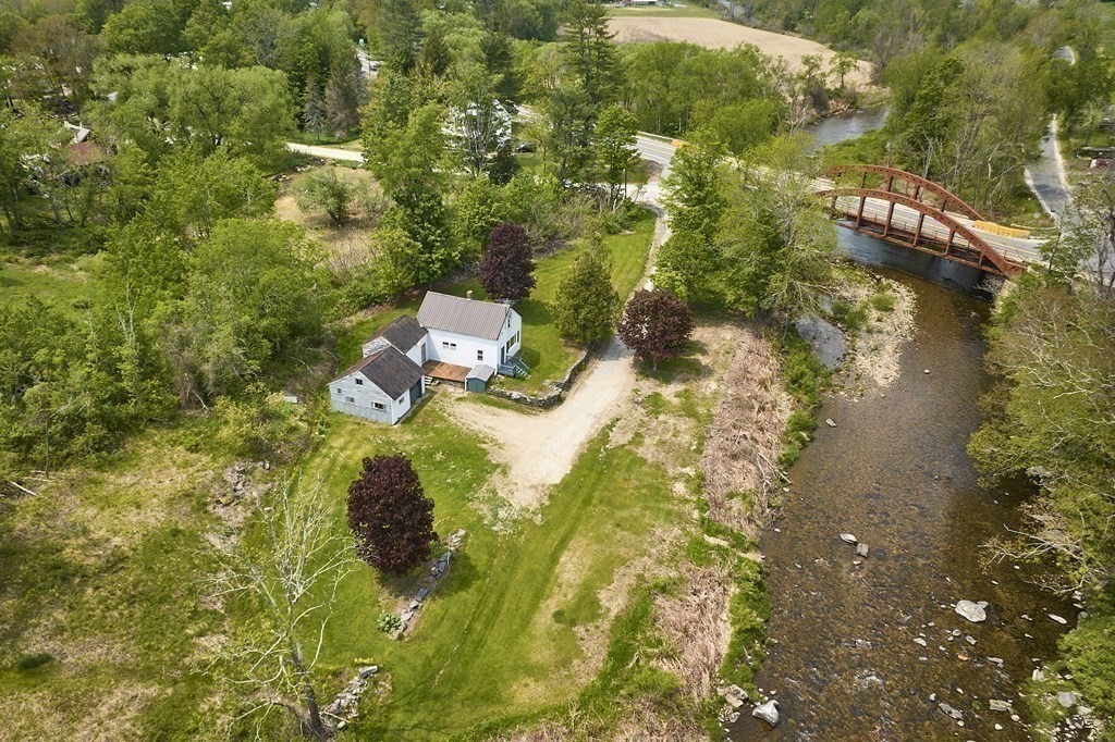 6 Mougin Road Cummington, MA 01026 - Photo 3 of 26 a backyard of a house with a yard and outdoor seating