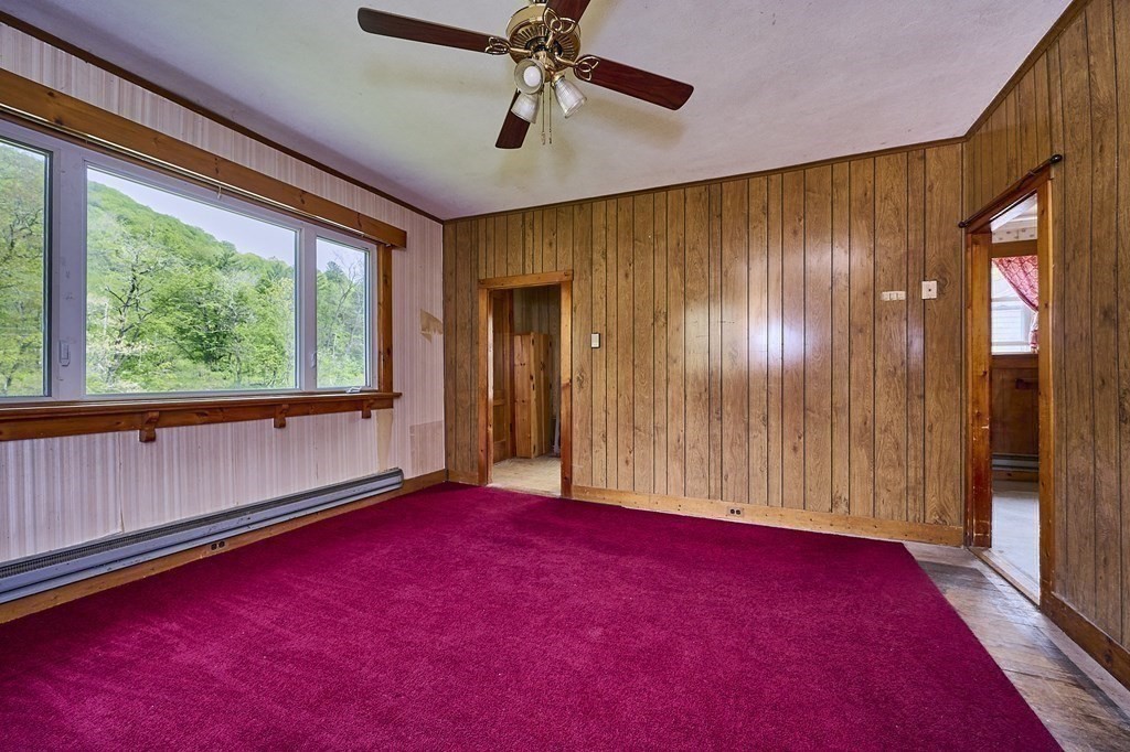 6 Mougin Road Cummington, MA 01026 - Photo 9 of 26 a view of empty room with windows